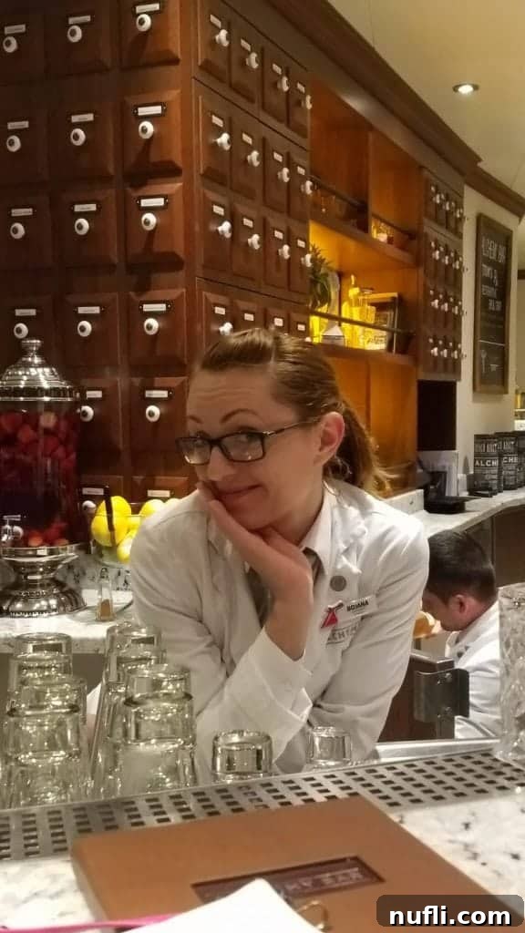 Carnival's Alchemy Bar: The Ultimate Cruise Hotspot 13 A vibrant, refreshing cocktail served in a classic martini glass at Alchemy Bar