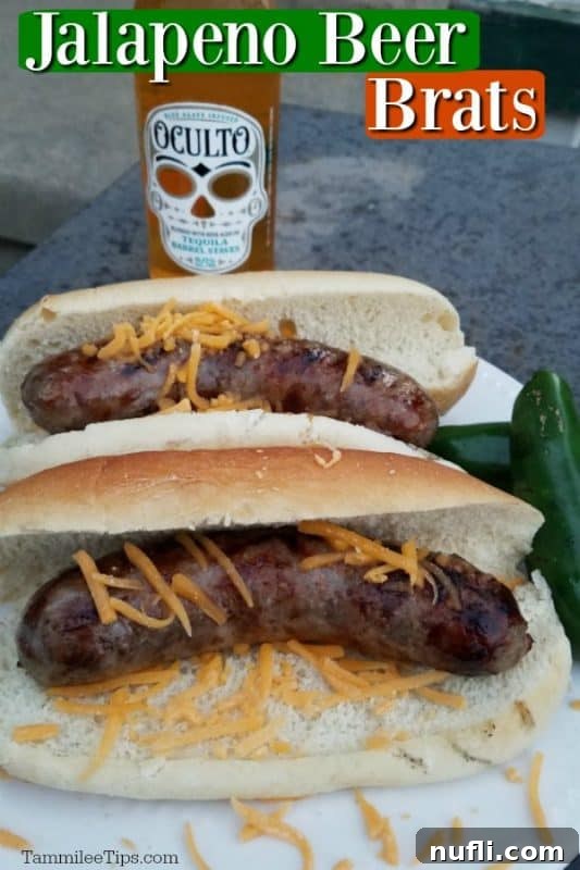 Bold Jalapeno Beer Brats 2 Jalapeno Beer Brats served on buns with a bottle of tequila barrel aged beer in the background