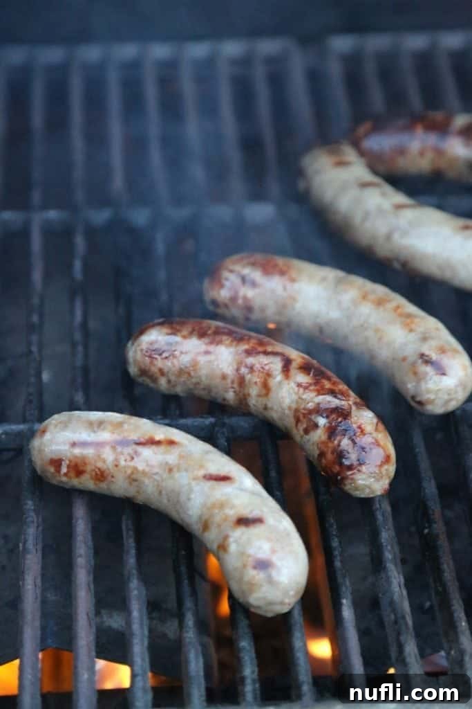Bold Jalapeno Beer Brats 4 Jalapeno Beer Brats grilling over an open flame
