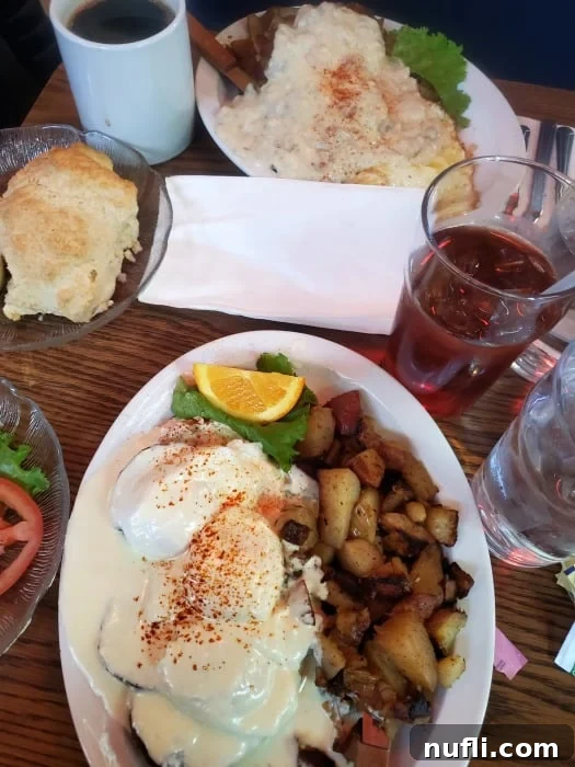 Multiple plates laden with gravy-covered potatoes and fluffy biscuits, a true comfort food spread