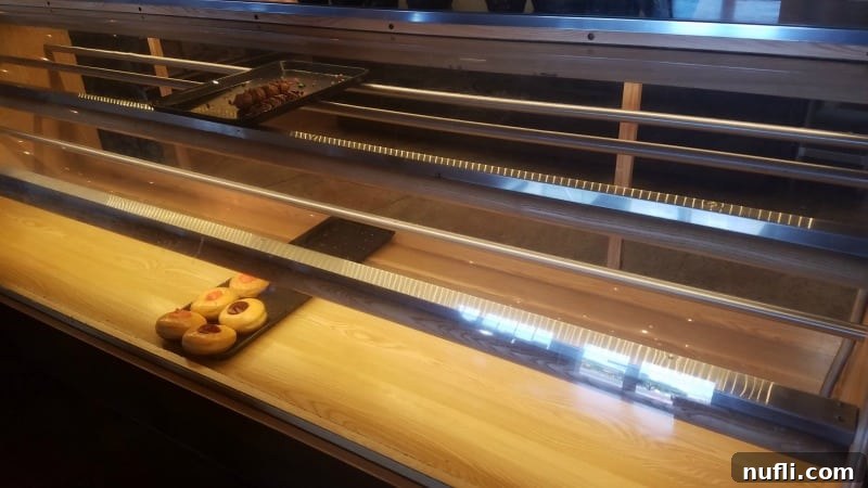 a few donuts on display at a bakery 
