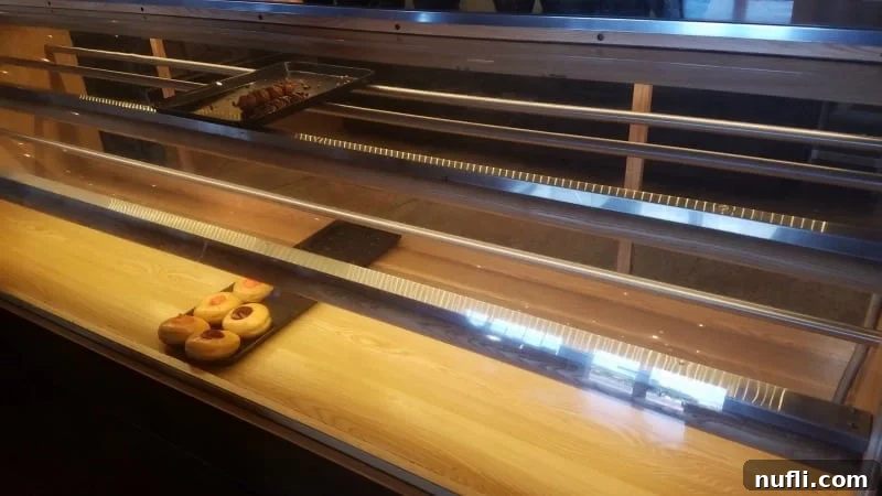 a few donuts on display at a bakery 