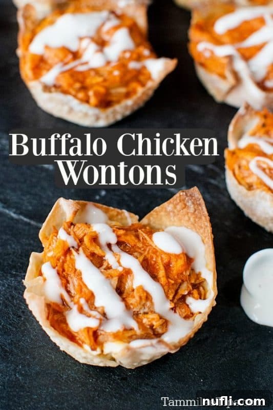 Golden brown Buffalo Chicken Wontons arranged on a dark slate board, ready to be served as an appetizer.