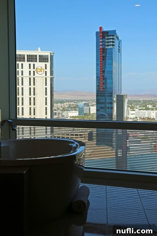 Close-up of a luxurious jetted tub in an Aria Tower Suite, inviting guests to relax with a view.