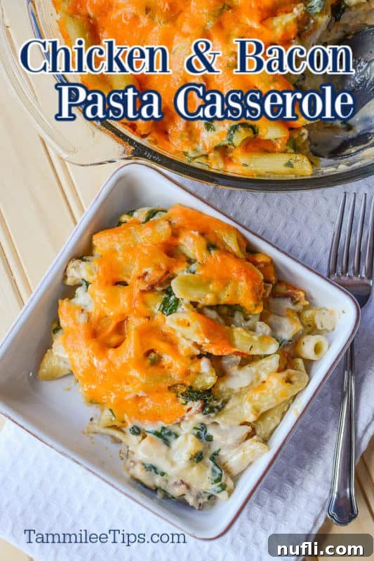 Chicken and Bacon pasta casserole over a white bowl with pasta and a silver fork, showcasing a rich, creamy texture and golden-brown cheese