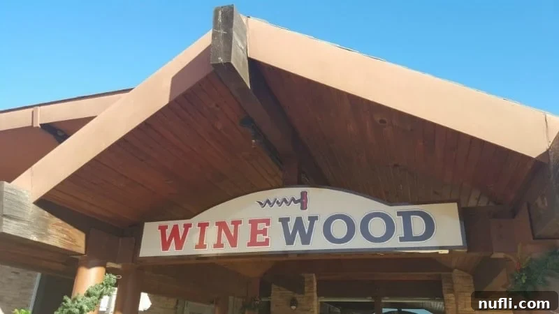 Elegant Wine wood sign with a wine cork, symbolizing WineWood's dedication to viticulture