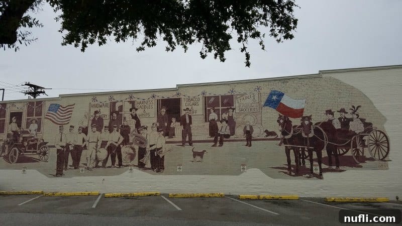 Texas history mural on the side of a buillding