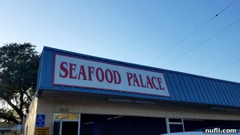 Exterior sign of Seafood Palace, a popular local restaurant in Lake Charles.