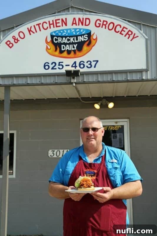 B&O Kitchen and Grocery Cracklins Daily sign over a man holding a plate 