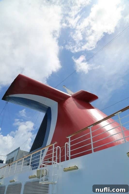 The iconic Carnival Magic funnel against a clear sky
