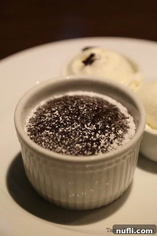 Carnival's famous chocolate melting cake, served on a pristine white plate, promising a decadent end to any meal.