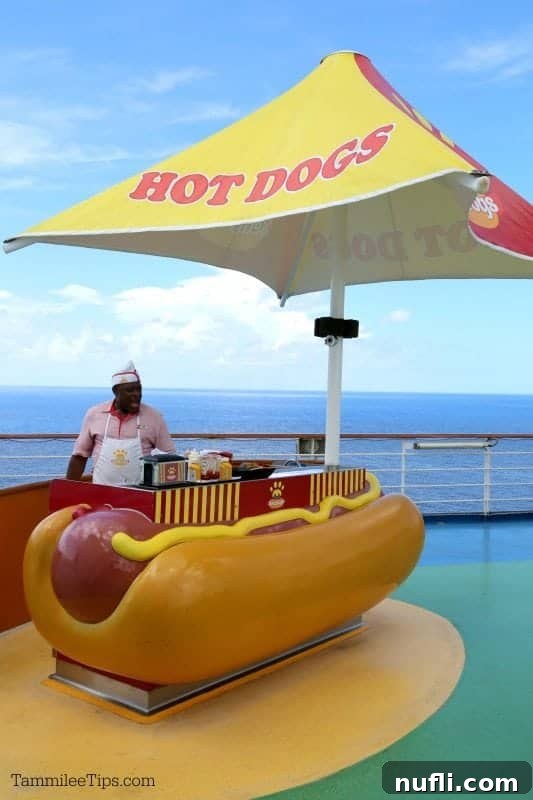 A quirky hot dog stand shaped like a giant hot dog, offering quick and delicious bites on the Lido Deck.