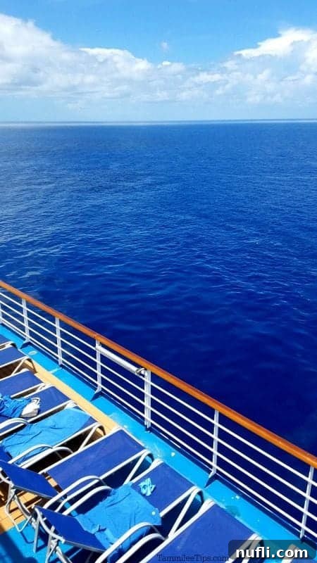 A stunning view over the deck of the Carnival Magic, gazing out at the vast, sparkling ocean.