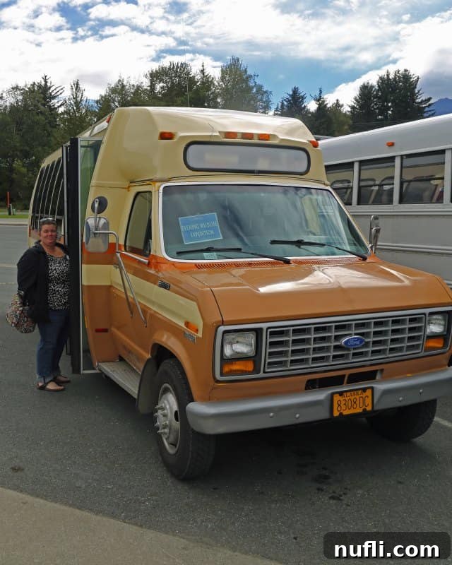 Tammilee getting into an orange and brown van in Haines