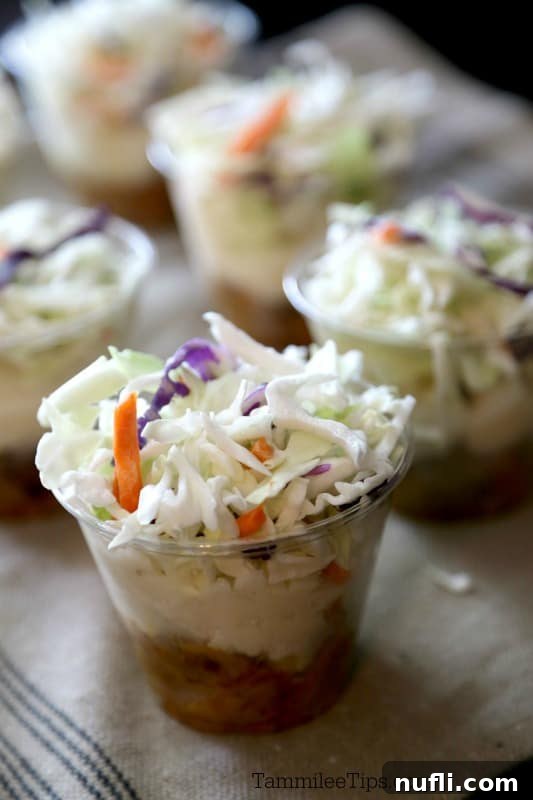 Layered Pulled Pork Perfection 3 pulled pork parfait cups lined up on a napkin