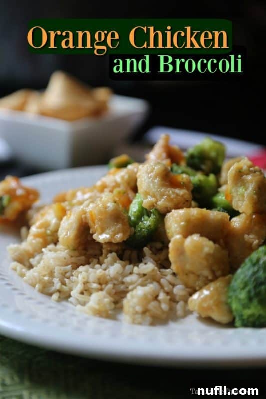 Take Out Style Orange Chicken and Broccoli over a bed of white rice on a white plate
