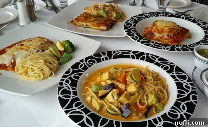 Plates filled with spaghetti, lasagna, and other Italian-inspired dishes, beautifully presented.