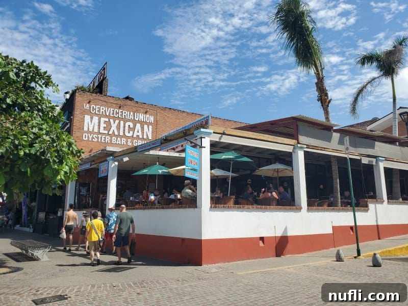 La Cerveceria Union, a Mexican Oyster Bar sign on the side of a building, overlooking the Malecon.