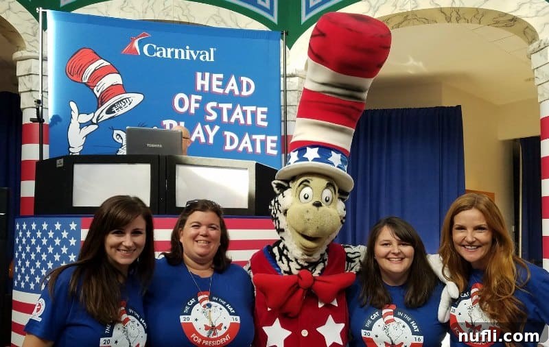 The Cat in the Hat character interacting with children at the Carnival Head of State Play Date, bringing smiles.