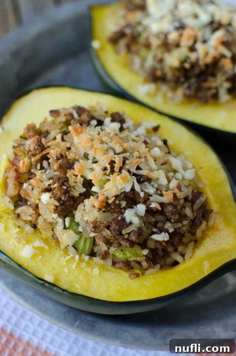 A single stuffed acorn squash half, beautifully presented on a plate with a simple cloth napkin, ready for a cozy meal.