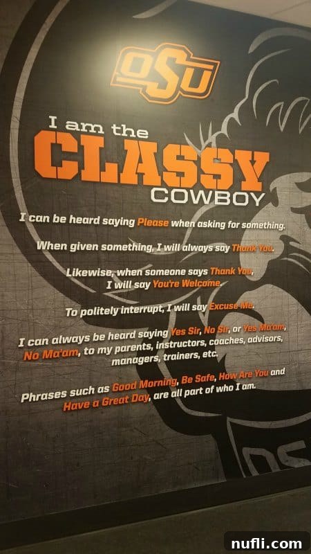 OSU motto 'I am the Classy Cowboy' displayed prominently on a wall inside the facility.