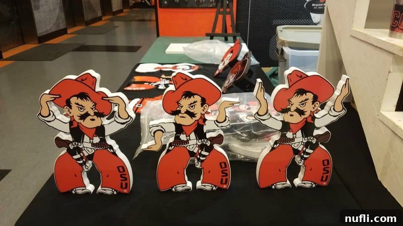 Display of OSU Cowboy figurines and memorabilia.
