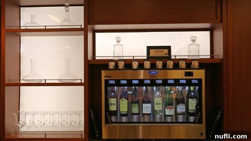 An innovative wine dispenser featured in the Library Bar, accompanied by elegant glasses and carafes, offering a sophisticated self-serve wine experience.
