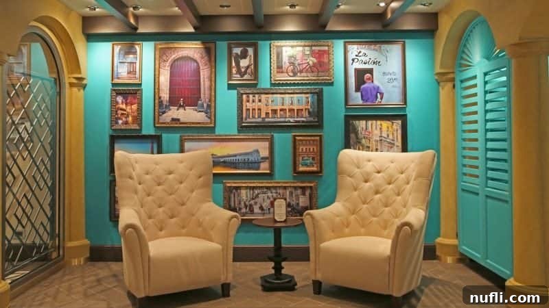 The inviting entrance to the Havana Club, adorned with white chairs and captivating paintings depicting scenes from Cuba on the wall.