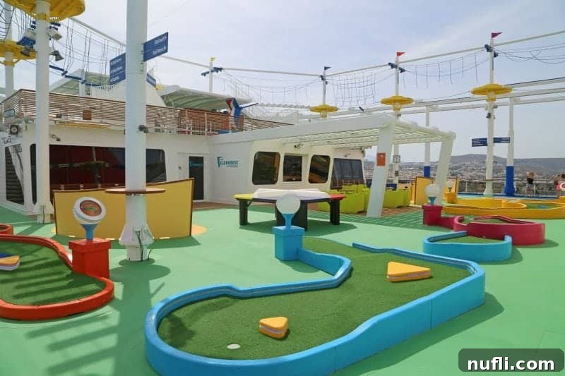 A colorful mini golf course on the Carnival Vista's upper deck, inviting guests to enjoy a leisurely game under the sun.