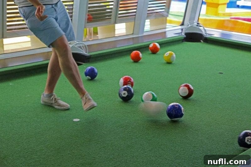A unique foot soccer pool game set up, combining elements of soccer and billiards for interactive fun.