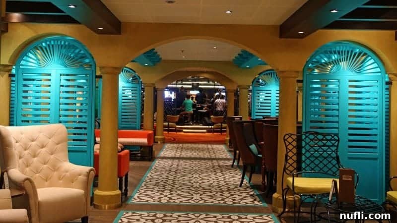 The lively Havana Bar entrance, featuring comfortable chairs and a long, welcoming carpet leading directly to the bar area.