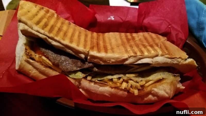 A mouth-watering Cuban sandwich, perfectly presented in a rustic basket, ready to be enjoyed.