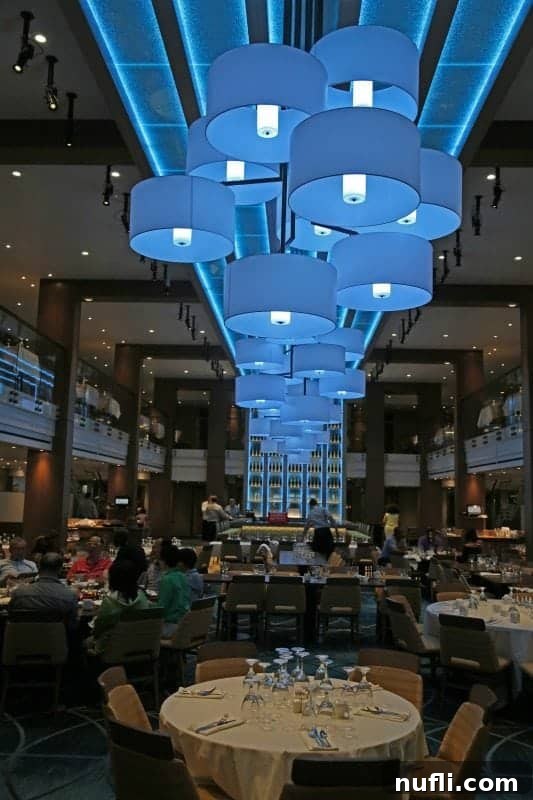 Reflections dining room with blue lights overhead and people dining 