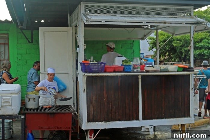 taco truck next to a green building
