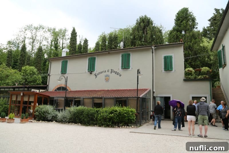 Tuscan Wine Cruise Excursion 5 Winery buiding with green shutters and people near the stairs
