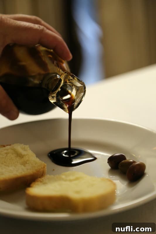 Tuscan Wine Cruise Excursion 6 hand pouring balsamic vinegar