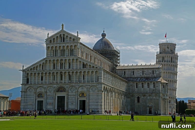 Fulfilling a Dream at the Leaning Tower of Pisa 3 Pisa Cathedral with the Leaning Tower visible in the background against a blue sky