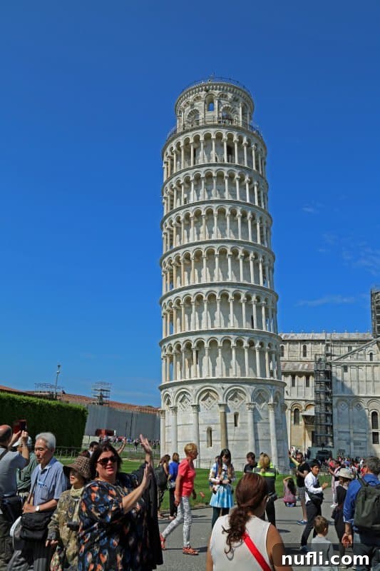Fulfilling a Dream at the Leaning Tower of Pisa 4 Tammilee posing creatively, appearing to hold up the Leaning Tower of Pisa