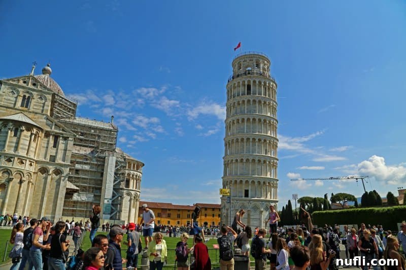 Fulfilling a Dream at the Leaning Tower of Pisa 5 People gathered around the Leaning Tower of Pisa, enjoying the atmosphere