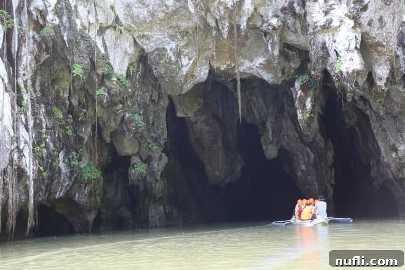 boat going into the entrance of a cave