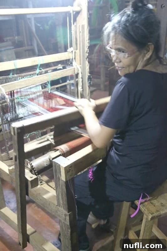 Discover Puerto Princesa: Your Palawan Adventure Guide 4 Palawan women skillfully weaving intricate patterns on a traditional loom