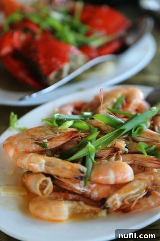 Discover Puerto Princesa: Your Palawan Adventure Guide 7 Delicious prawns garnished with green onions on a pristine white platter