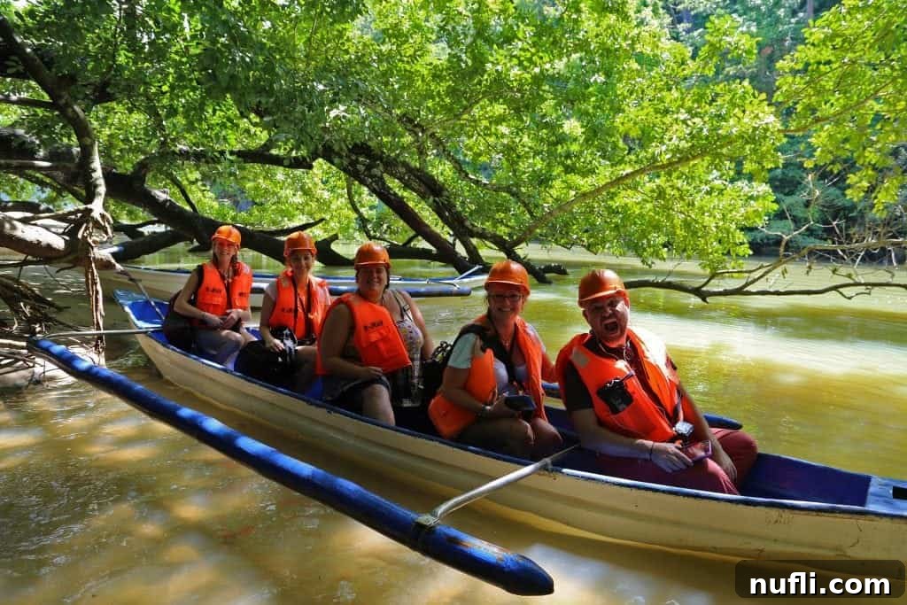 Discover Puerto Princesa: Your Palawan Adventure Guide 10 Tammilee and four companions navigating the Puerto Princesa Subterranean River National Park in a canoe