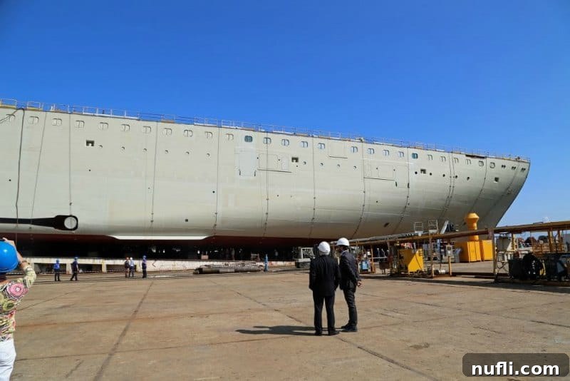 The Horizon Begins: Keel Laid for Carnival's Latest Gem in Italy 3 The impressive scale of the Carnival Horizon under construction at the Fincantieri shipyard, with workers visible on scaffolding