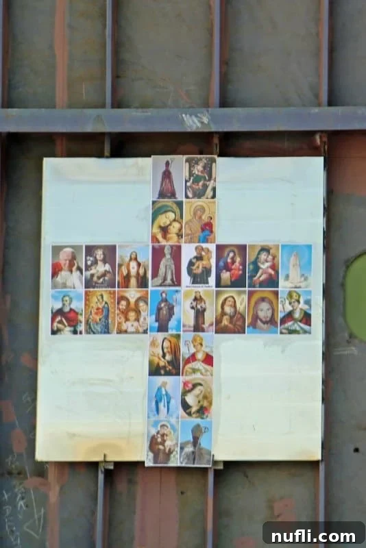 A religious cross adorned with saints displayed on a section of the Carnival Horizon, blessed during the ceremony.