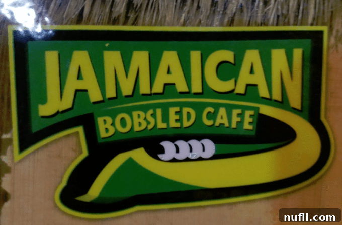 Jamaican Bobsled Cafe with 'Cool Runnings' playing on screen at Montego Bay airport