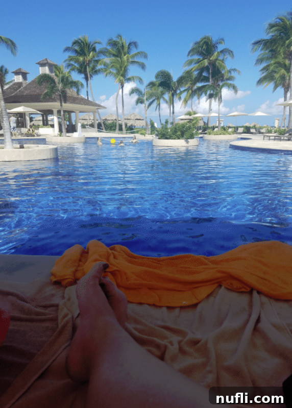 Relaxing by the pool in Jamaica, enjoying the warm sun and serene atmosphere
