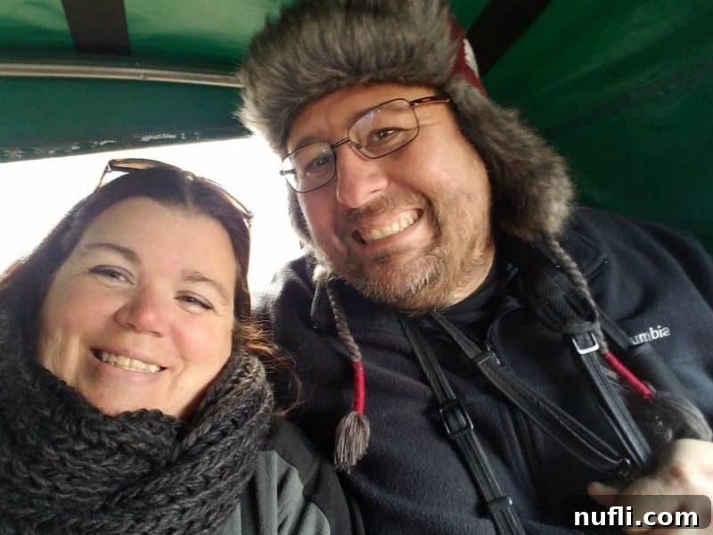 Tammilee and John enjoying a traditional horse-drawn carriage ride, a picturesque way to experience the Bavarian countryside.