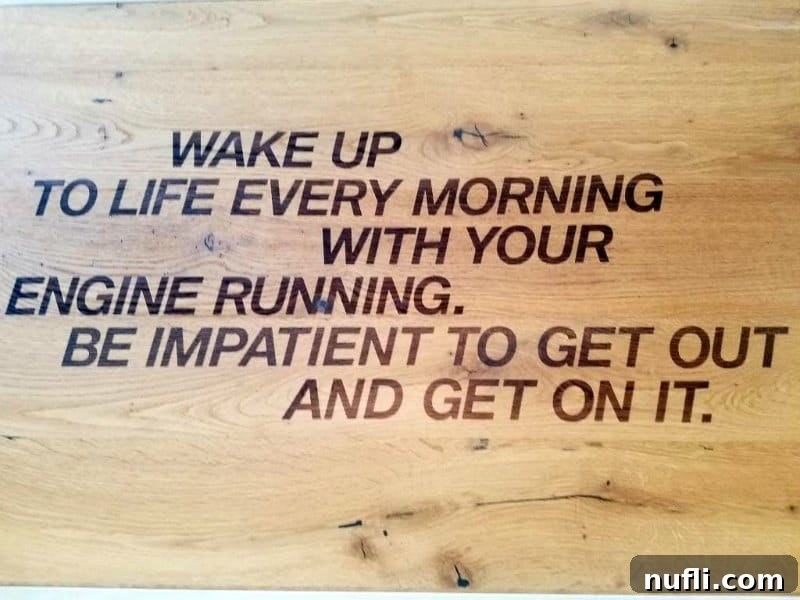 An inspirational sign at BMW Welt reading: 'Wake up to life every morning with your engine running.'