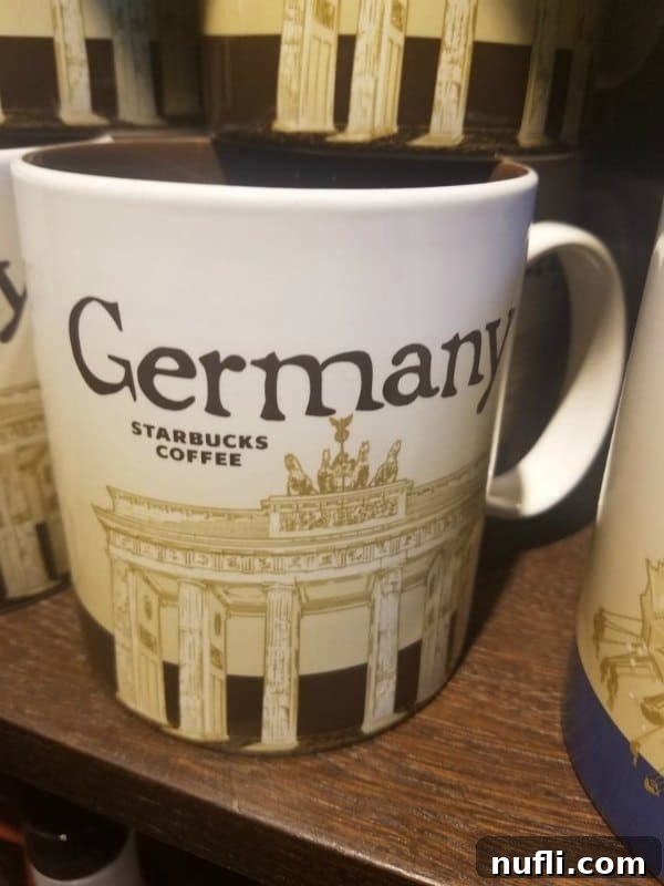 A 'Germany' themed Starbucks coffee mug, a popular souvenir for coffee lovers.